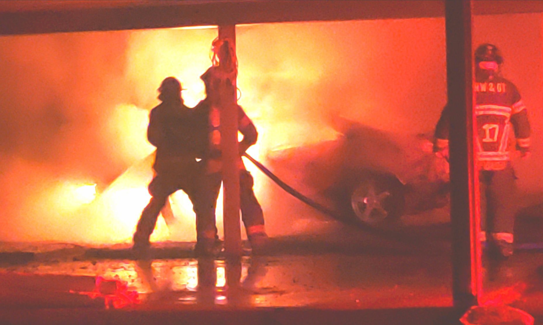 Home threatened by car fire